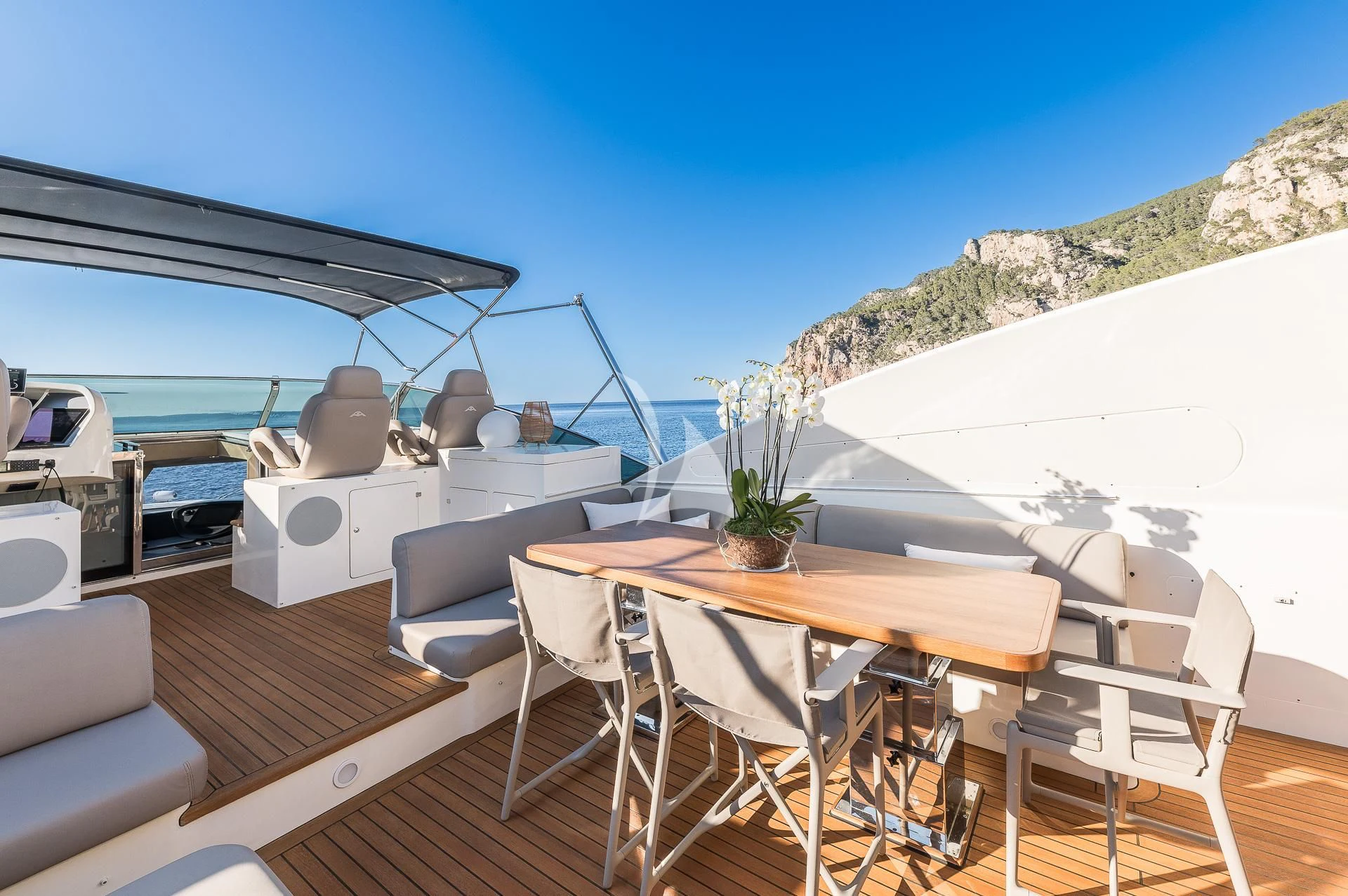 a table and chairs on a deck aboard B4 Yacht for Charter