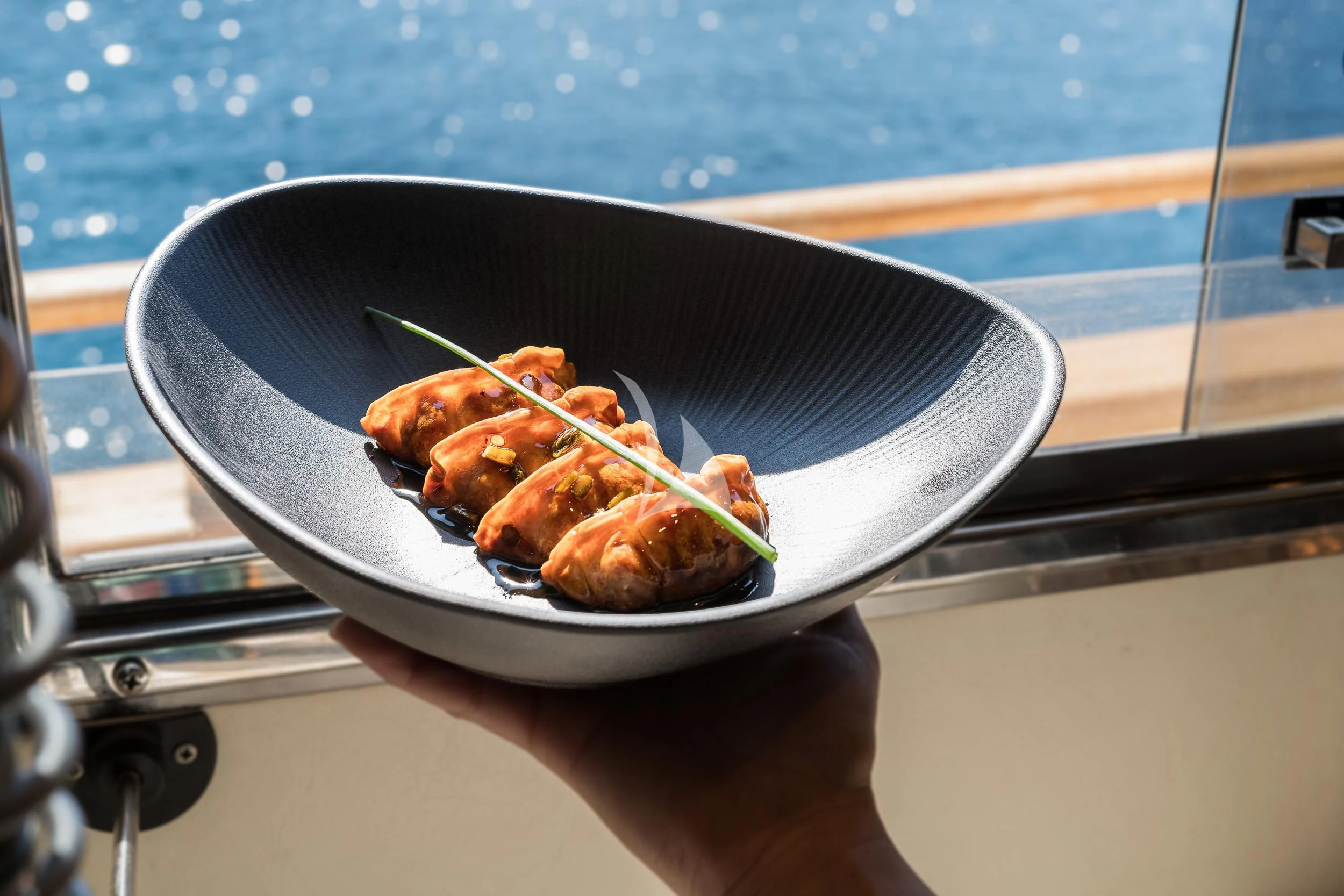 a plate of food on a boat aboard B4 Yacht for Charter