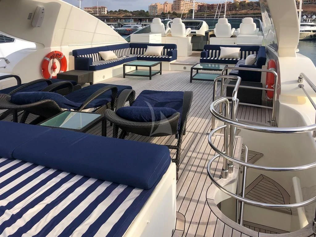 a room with chairs and tables aboard B4 Yacht for Charter