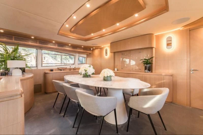 a kitchen with a table and chairs aboard B4 Yacht for Charter