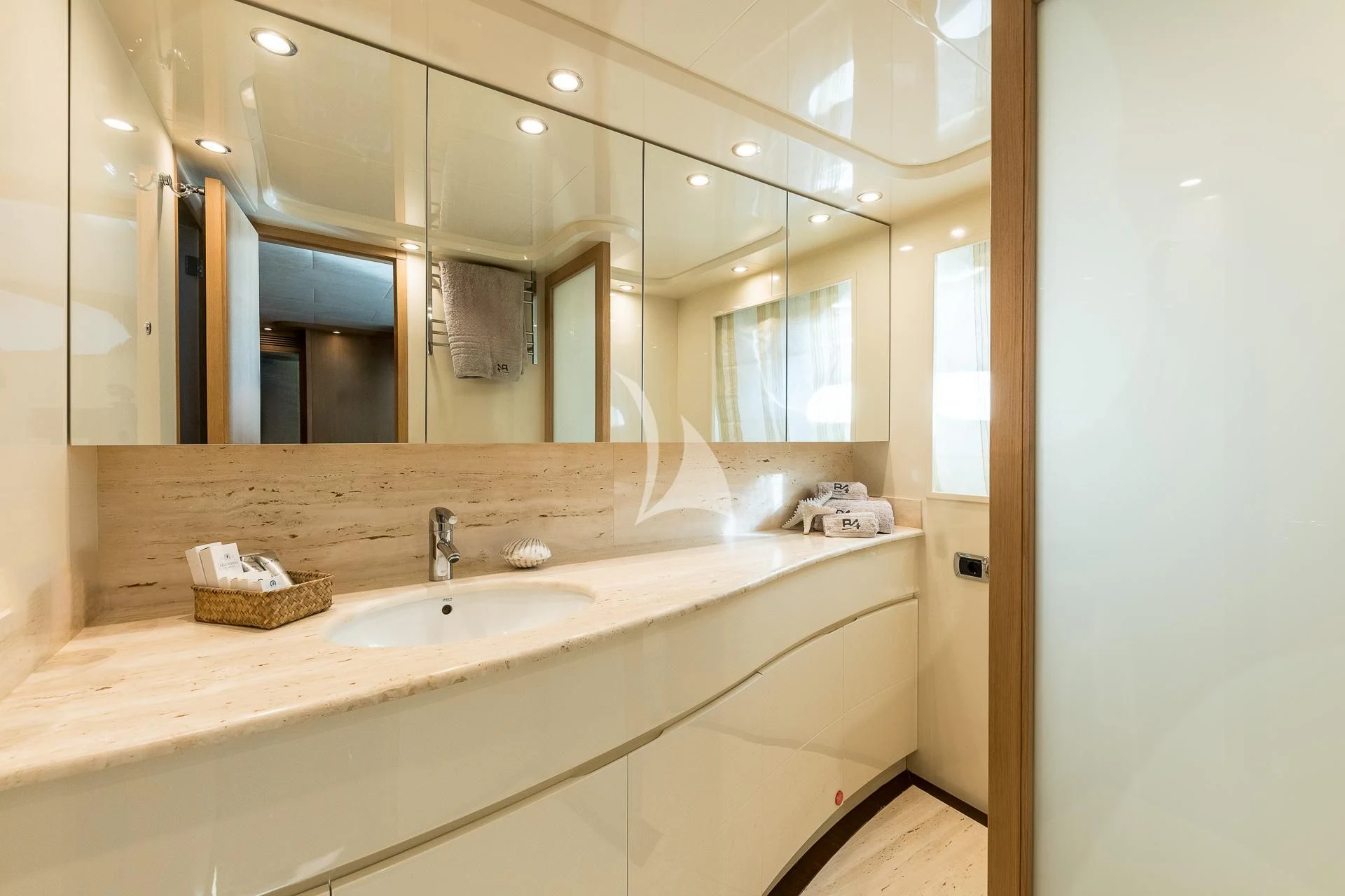 a bathroom with a large mirror aboard B4 Yacht for Charter
