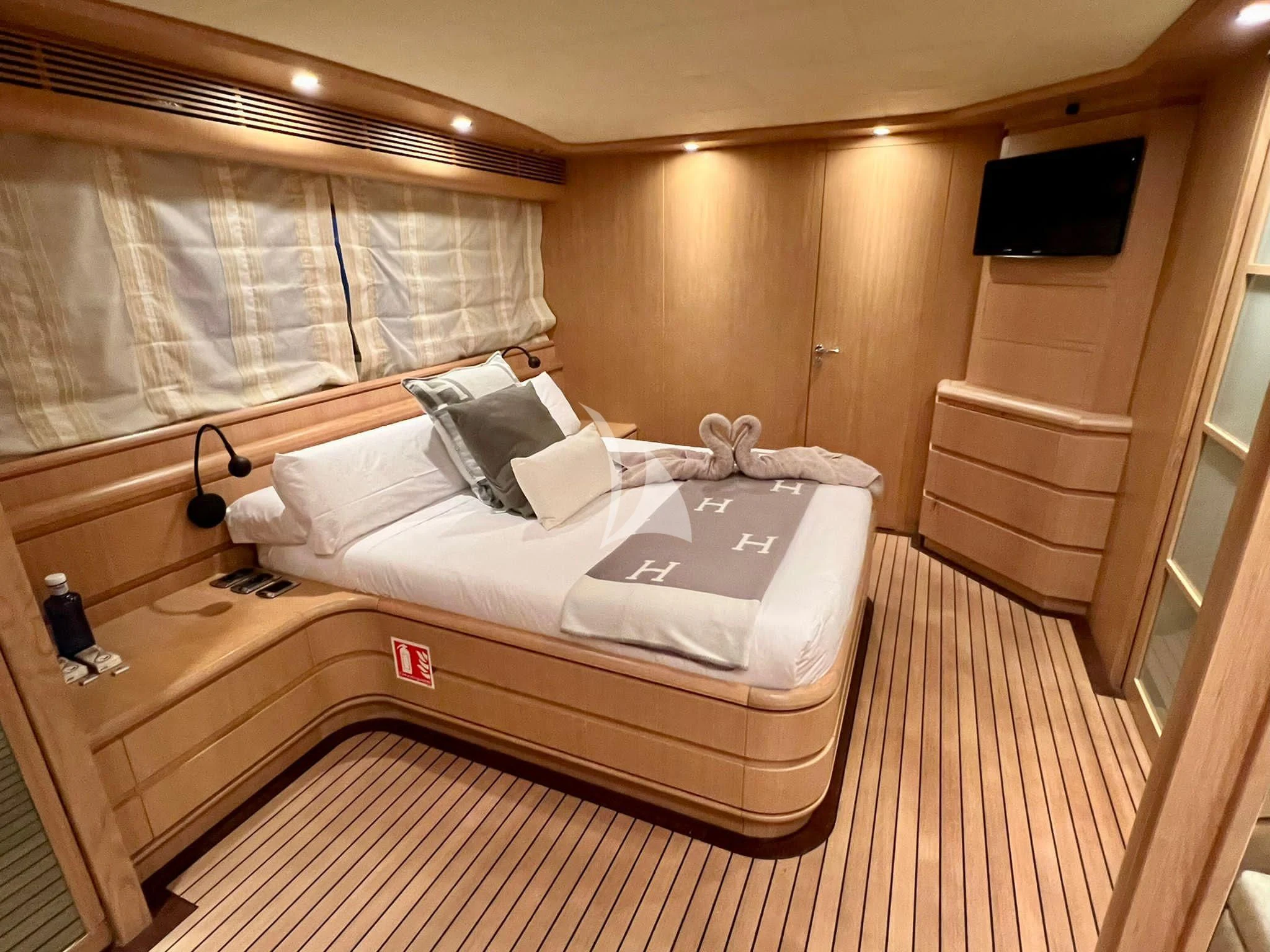 a bed in a room aboard B4 Yacht for Charter