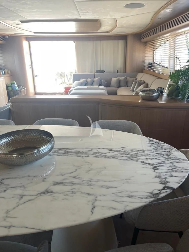 a kitchen with a table and chairs aboard B4 Yacht for Charter