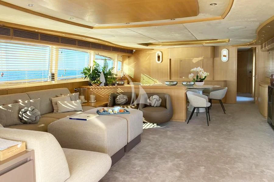 a living room with a couch and a table aboard B4 Yacht for Charter