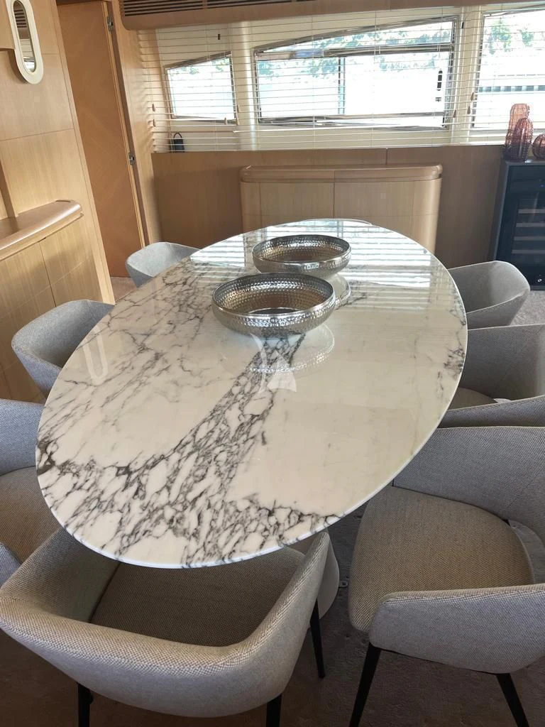 a round table with chairs around it aboard B4 Yacht for Charter