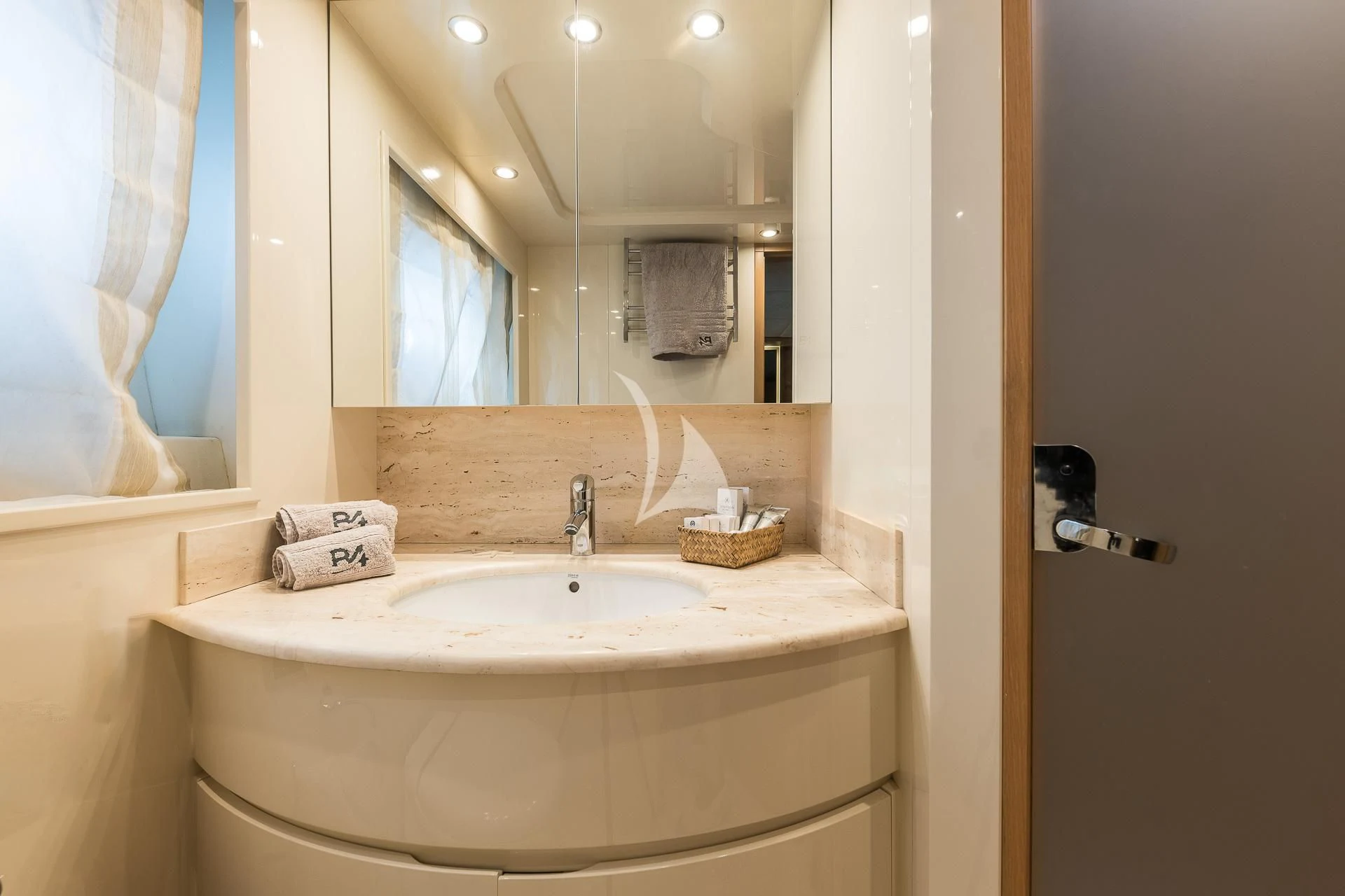 a bathroom with a large mirror aboard B4 Yacht for Charter