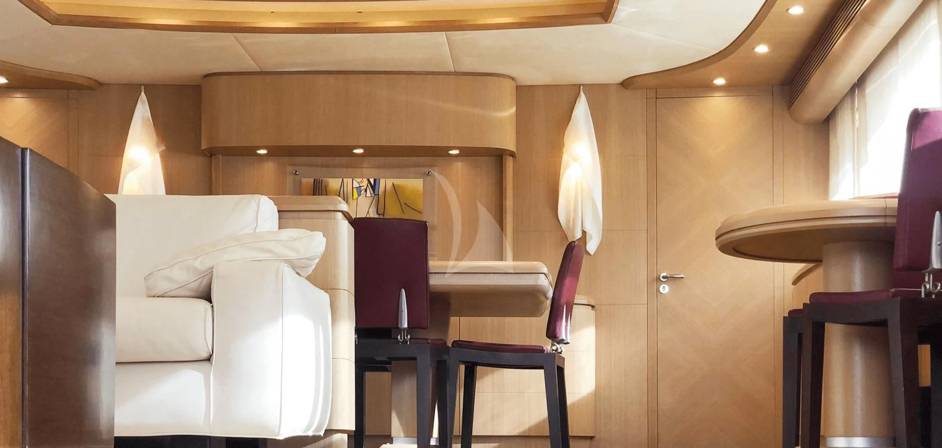 a room with a couch and a chair aboard B4 Yacht for Charter