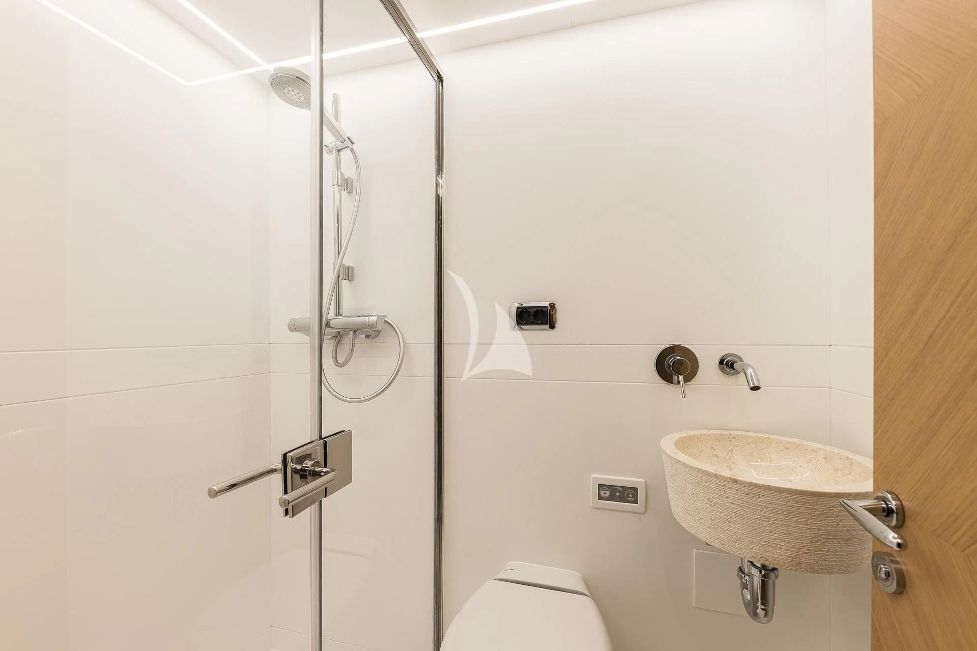 a bathroom with a shower sink and toilet aboard B4 Yacht for Charter