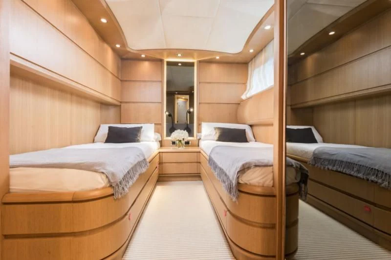 a room with a couple of beds aboard B4 Yacht for Charter