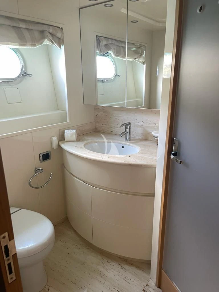 a bathroom with a sink and toilet aboard B4 Yacht for Charter