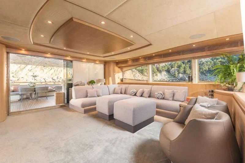 a living room with a large window aboard B4 Yacht for Charter