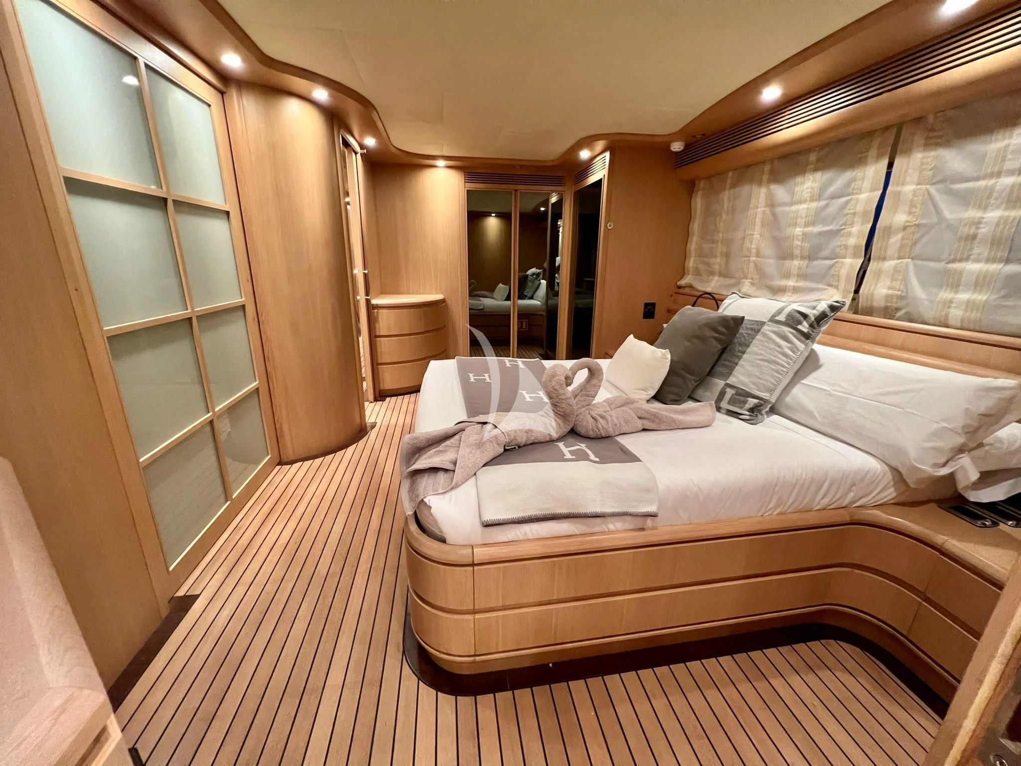 a room with a bed and a door aboard B4 Yacht for Charter