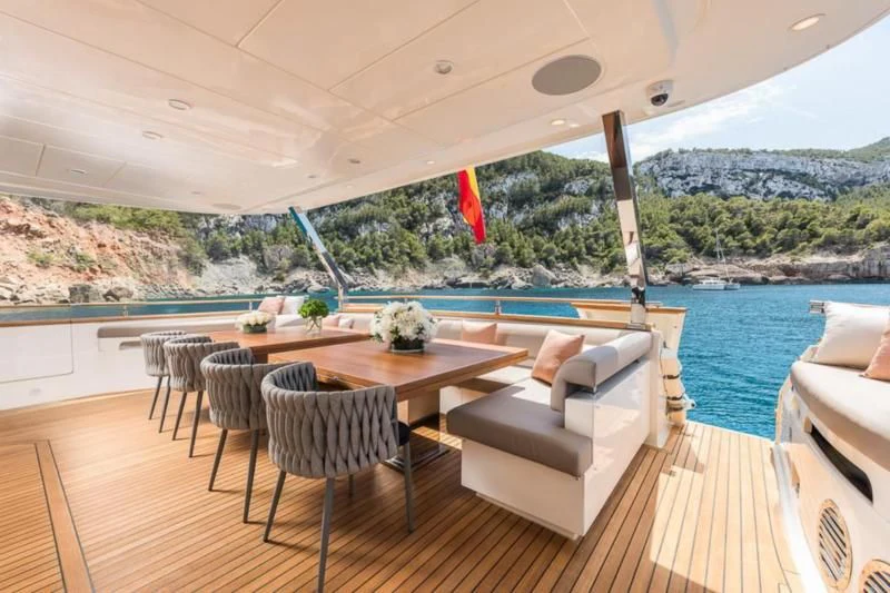 a patio with a table and chairs aboard B4 Yacht for Charter