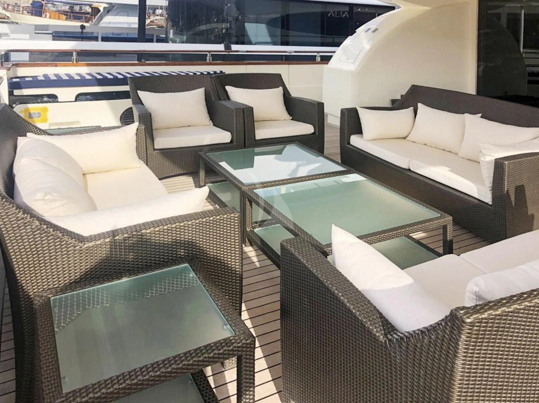 a room with couches and a table aboard B4 Yacht for Charter