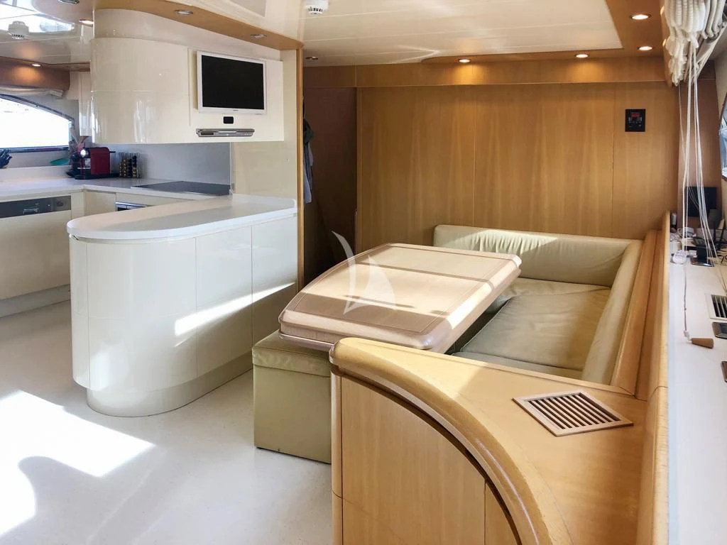 a room with a bed and a desk aboard B4 Yacht for Charter