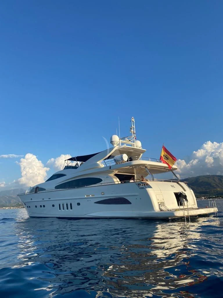 a large white boat on the water aboard B4 Yacht for Charter