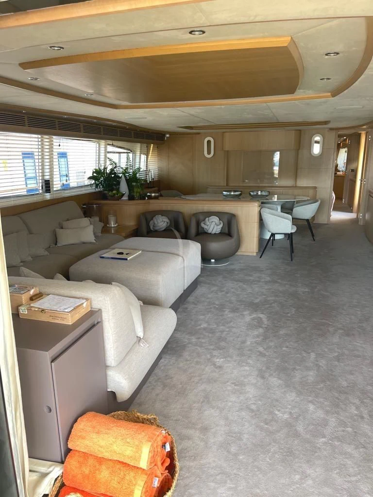 a living room with a couch and a table aboard B4 Yacht for Charter