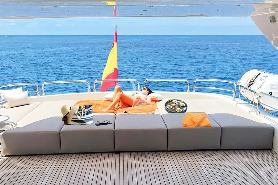 a boat with a sail on the water aboard B4 Yacht for Charter