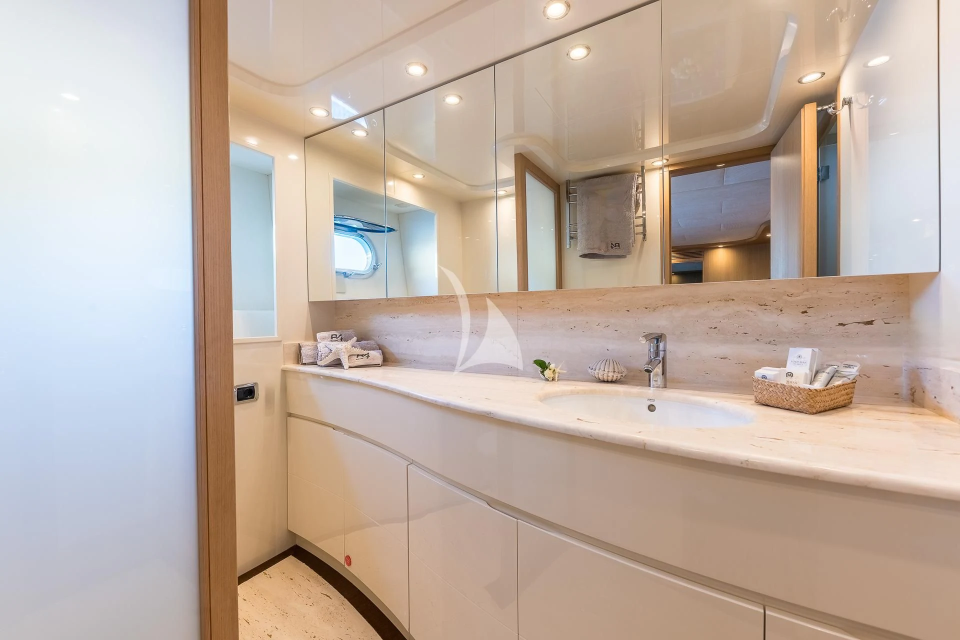 a bathroom with a large mirror aboard B4 Yacht for Charter
