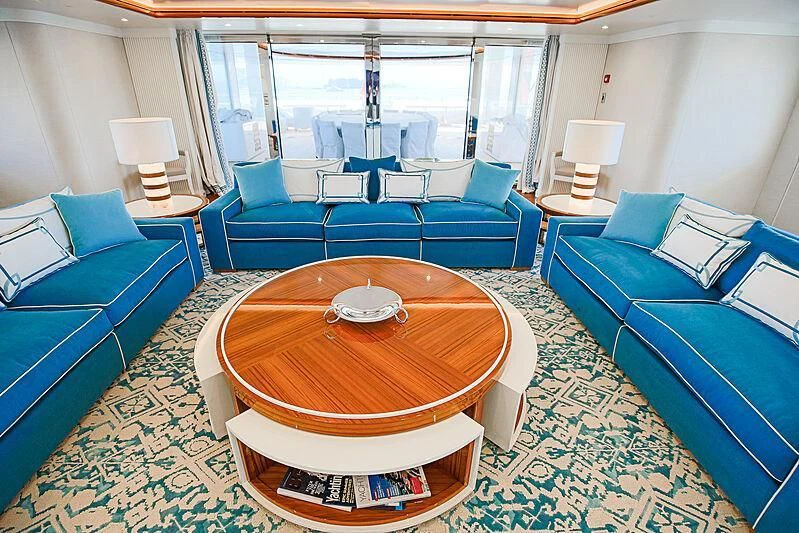 a room with a table and chairs aboard MIMTEE Yacht for Sale