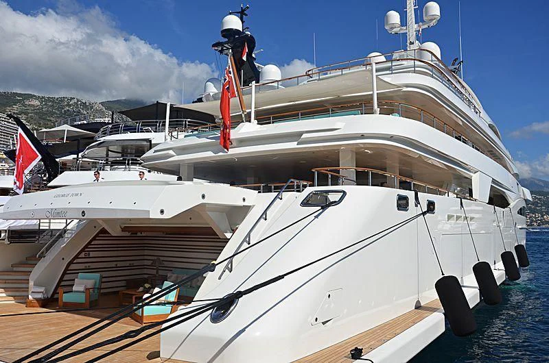 a large white boat with a red crane on the deck aboard MIMTEE Yacht for Sale
