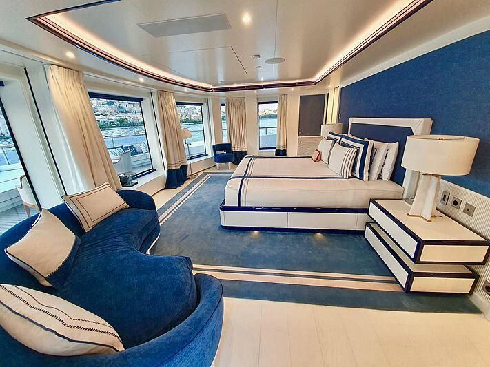a living room with a couch and a table aboard MIMTEE Yacht for Sale