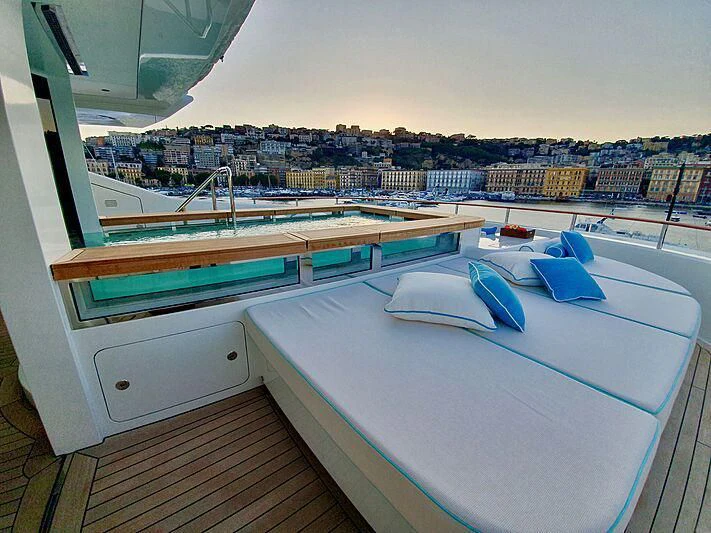 a balcony overlooking a city aboard MIMTEE Yacht for Sale