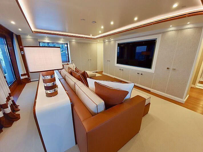 a room with a couch and a television aboard MIMTEE Yacht for Sale