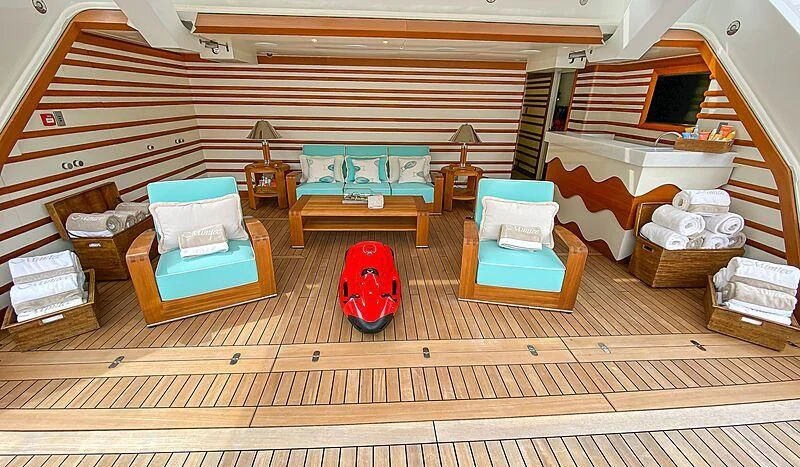 a room with a bed and a couch aboard MIMTEE Yacht for Sale