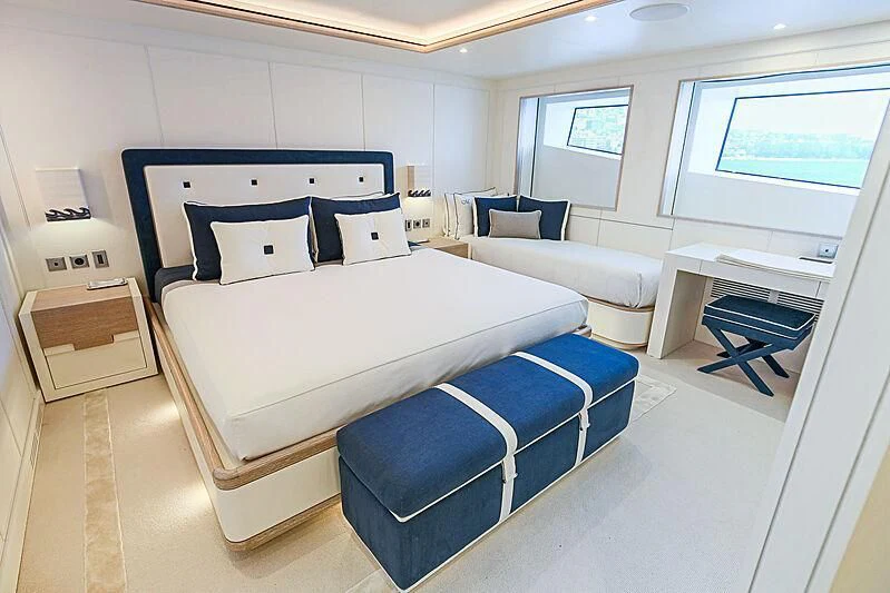 a room with a bed and a desk aboard MIMTEE Yacht for Sale