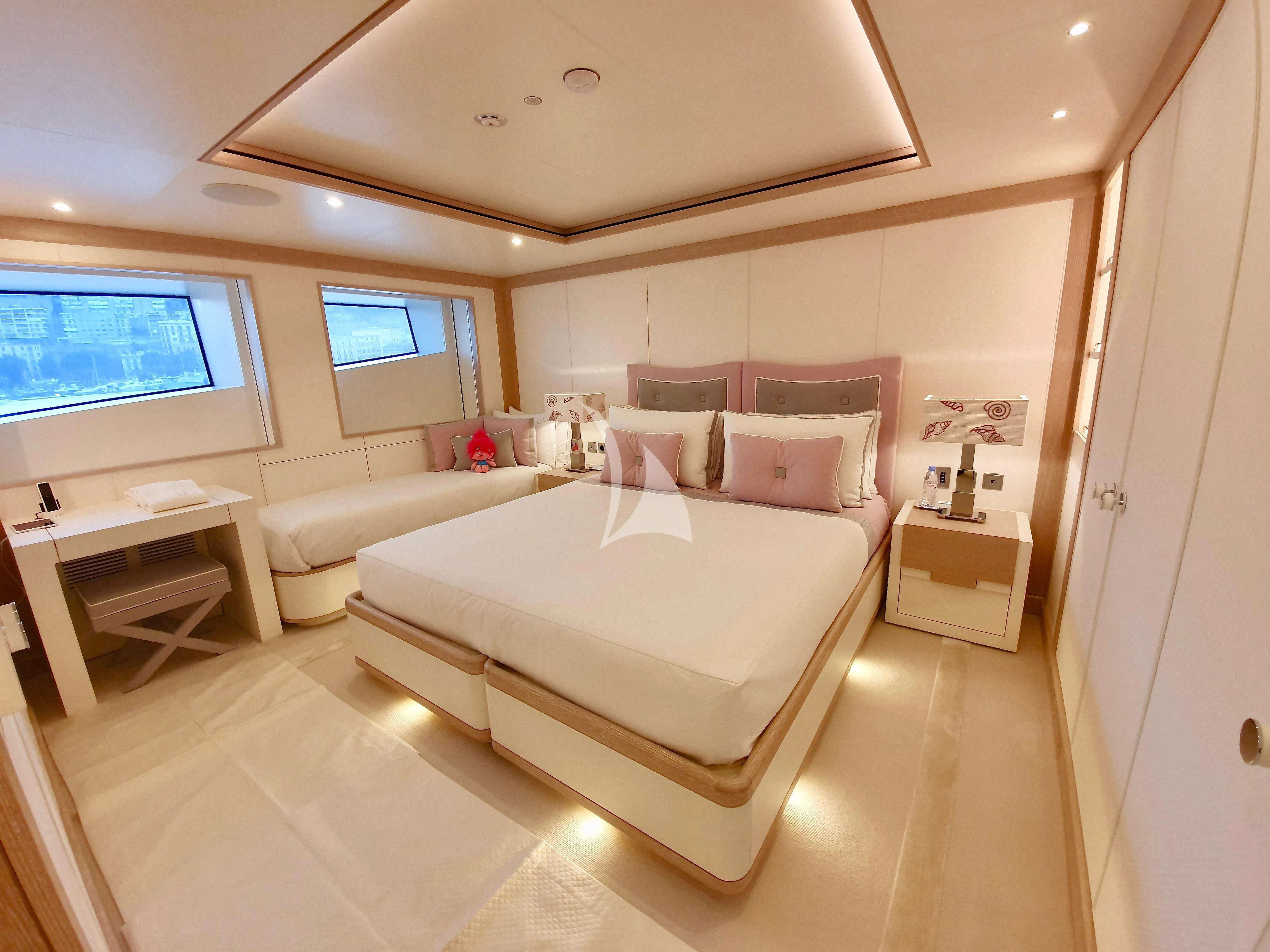 a room with a bed and a window aboard MIMTEE Yacht for Sale