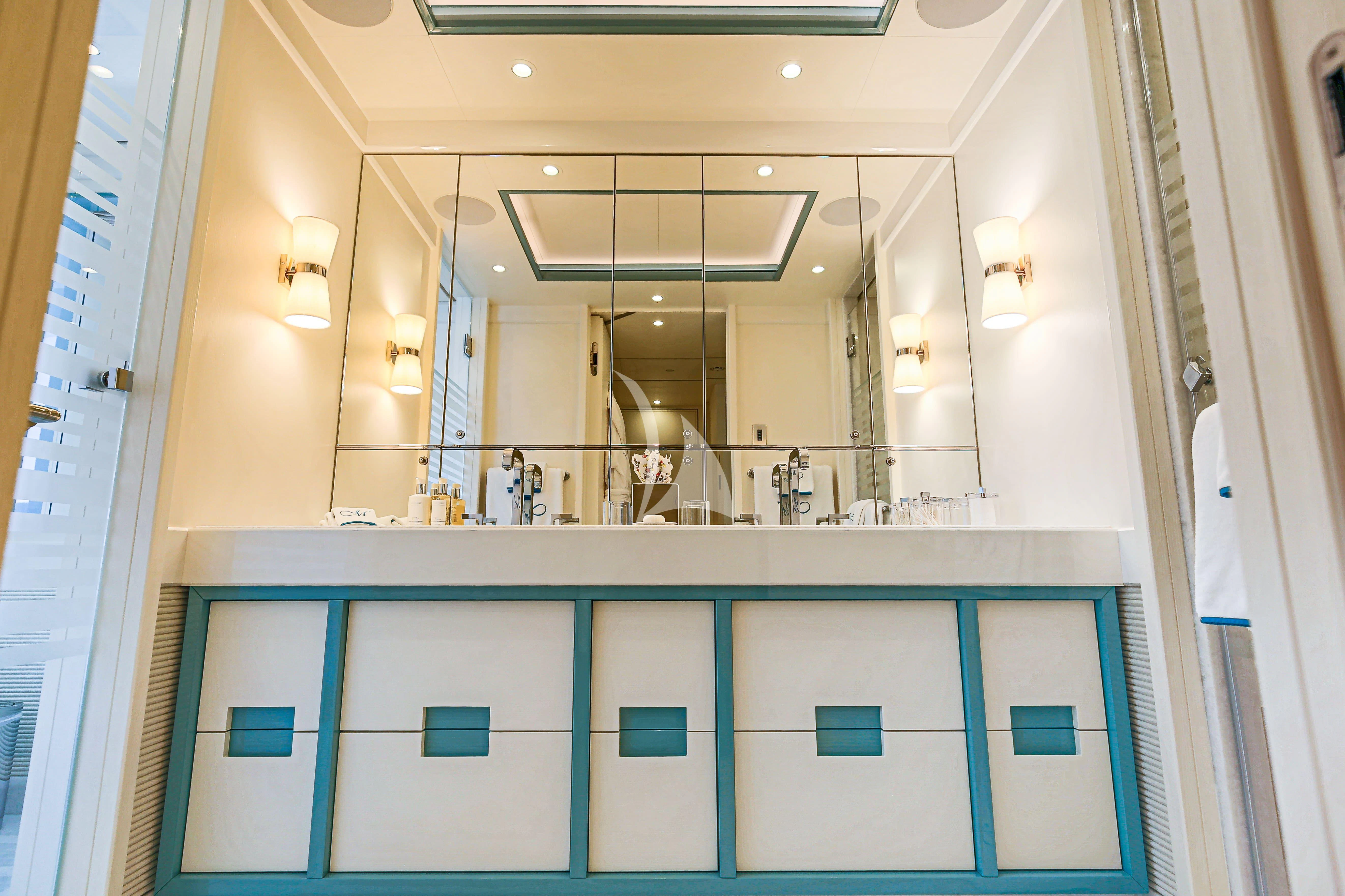 a bathroom with a large mirror aboard MIMTEE Yacht for Sale