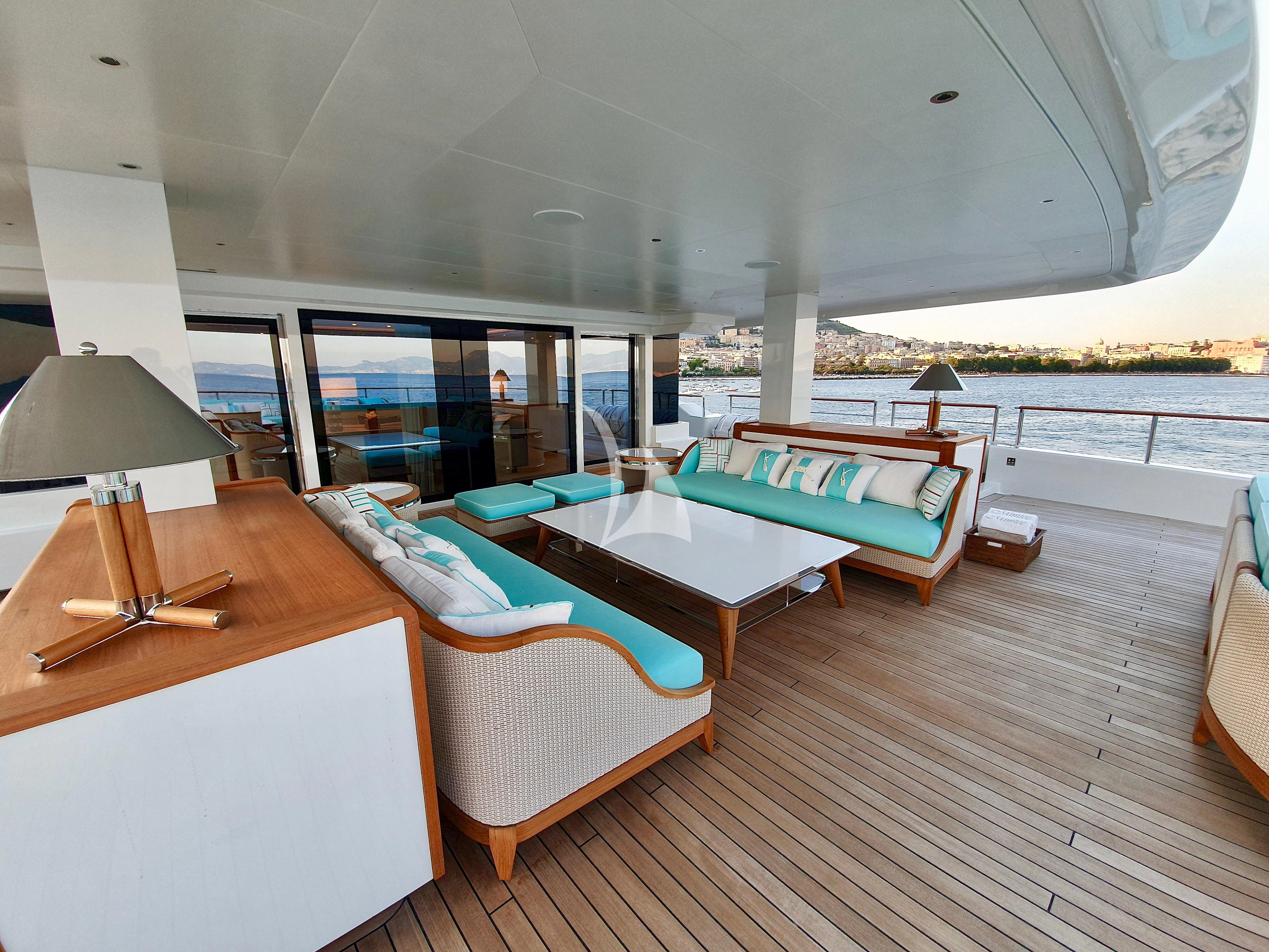a room with a table and chairs aboard MIMTEE Yacht for Sale