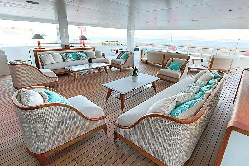 a room with couches and a table aboard MIMTEE Yacht for Sale