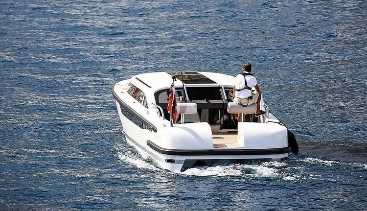 a man on a boat aboard MIMTEE Yacht for Sale