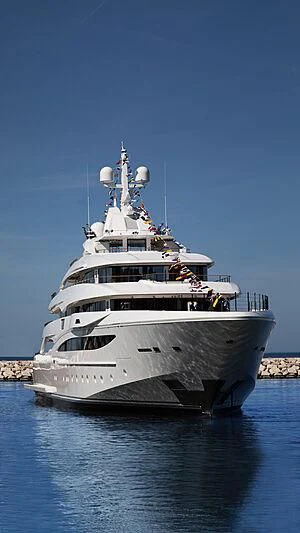 a large ship in the water aboard MIMTEE Yacht for Sale