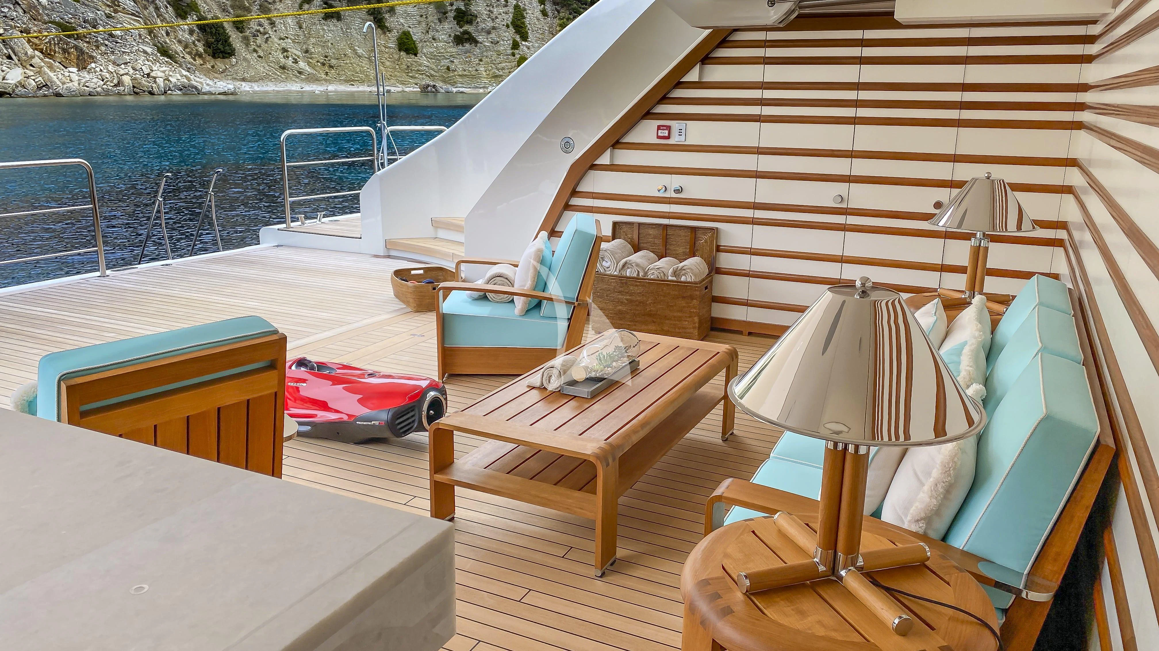 a room with a bed and a table and chairs aboard MIMTEE Yacht for Sale