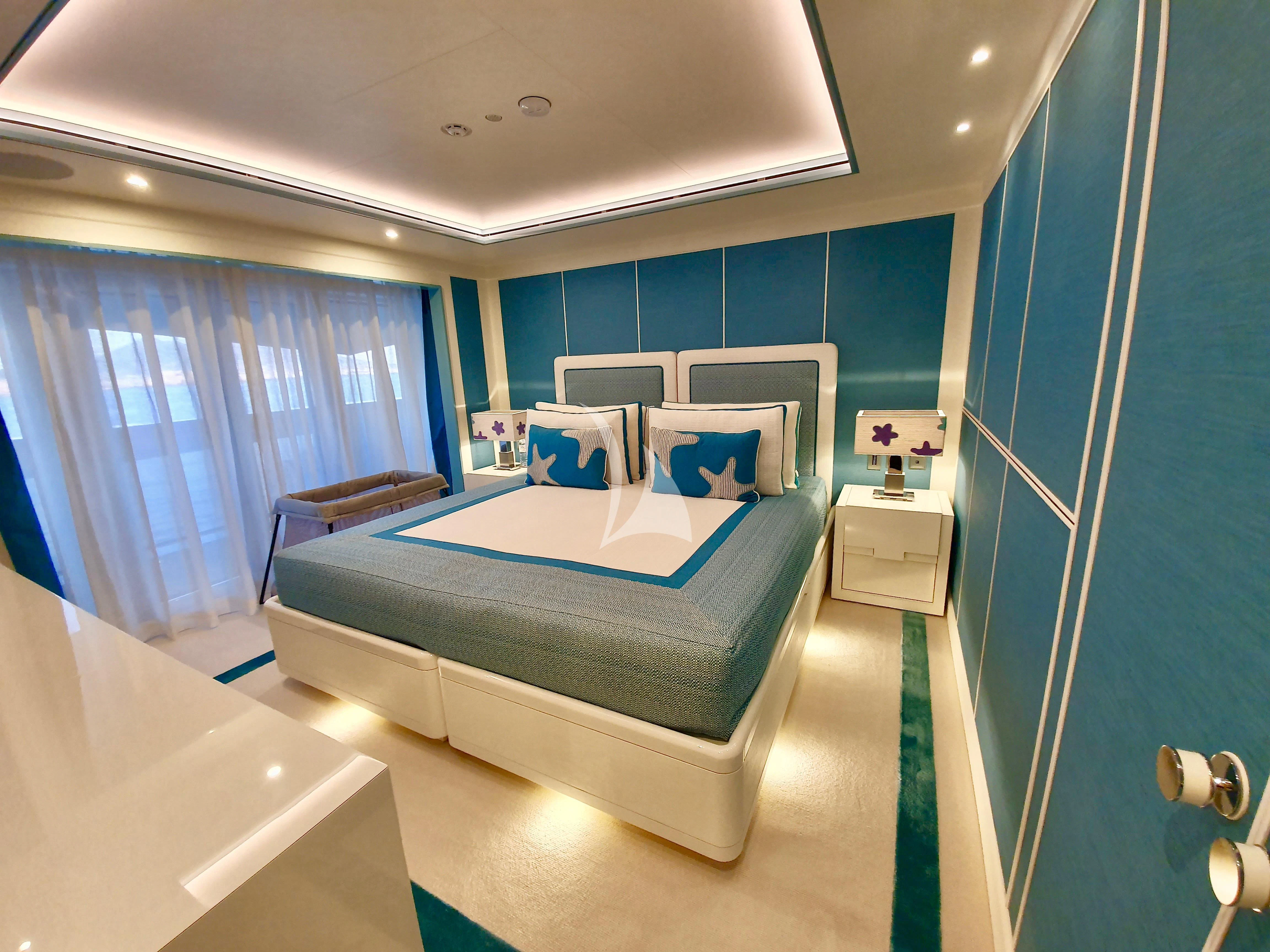 a bedroom with a bed and a bathtub aboard MIMTEE Yacht for Sale