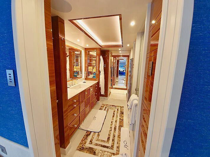 a hallway with a white door and a tile floor aboard MIMTEE Yacht for Sale