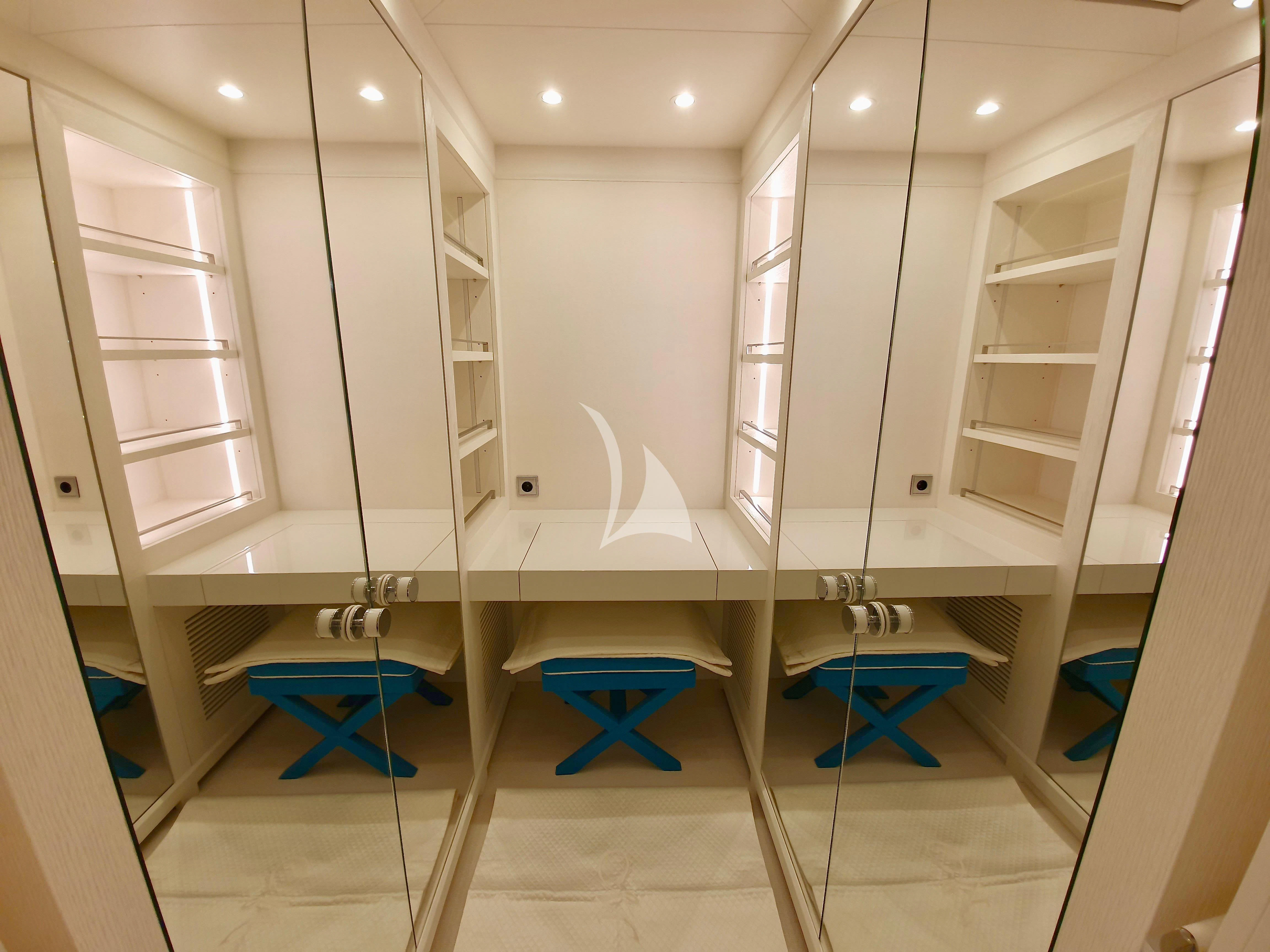 a bathroom with a large mirror aboard MIMTEE Yacht for Sale