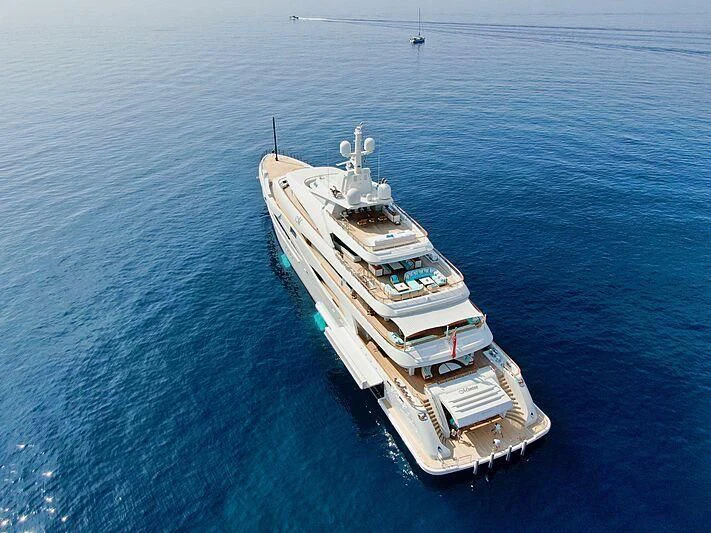 a large ship in the water aboard MIMTEE Yacht for Sale
