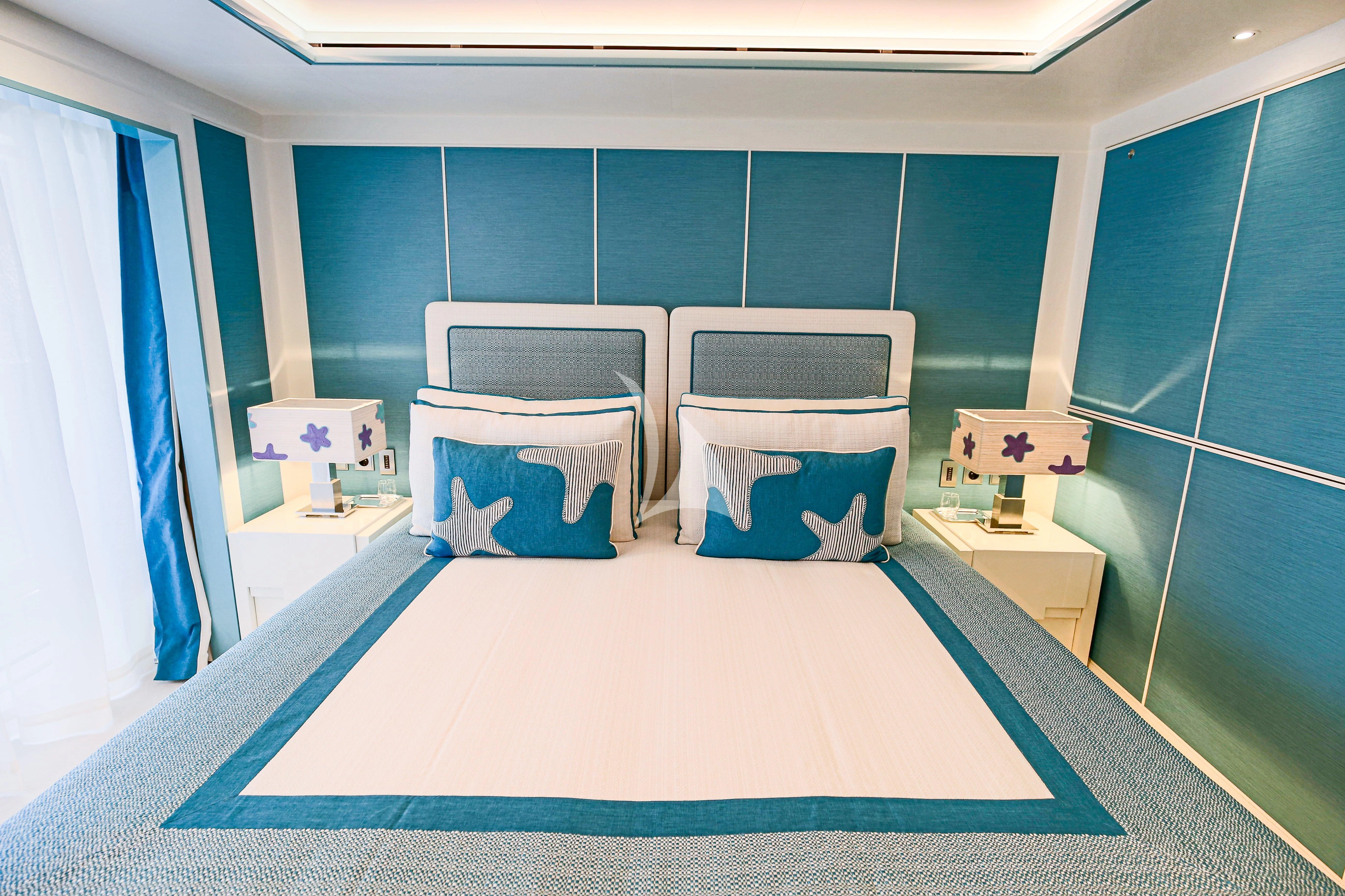 a room with a bed and a chair aboard MIMTEE Yacht for Sale