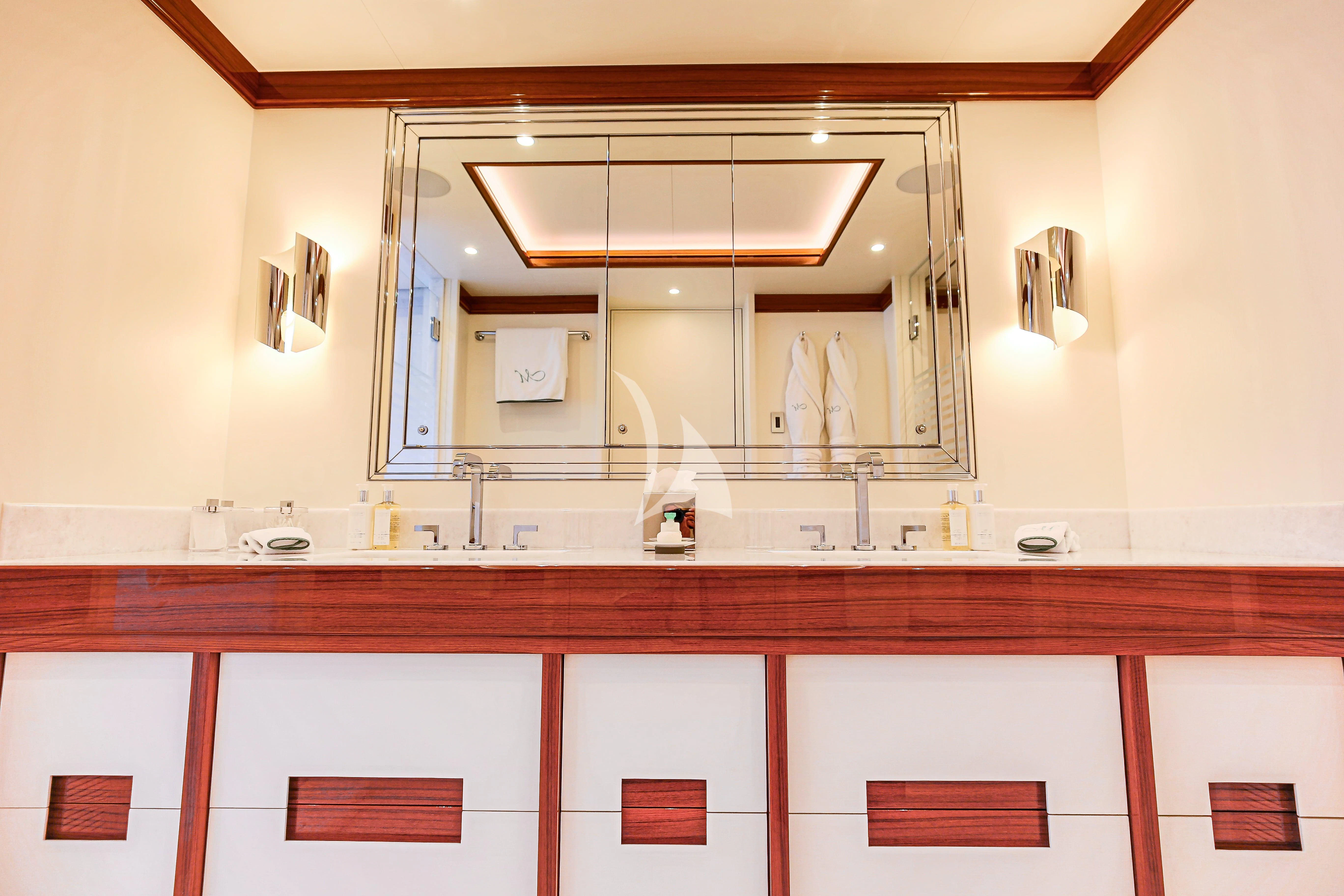 a bathroom with a large mirror aboard MIMTEE Yacht for Sale