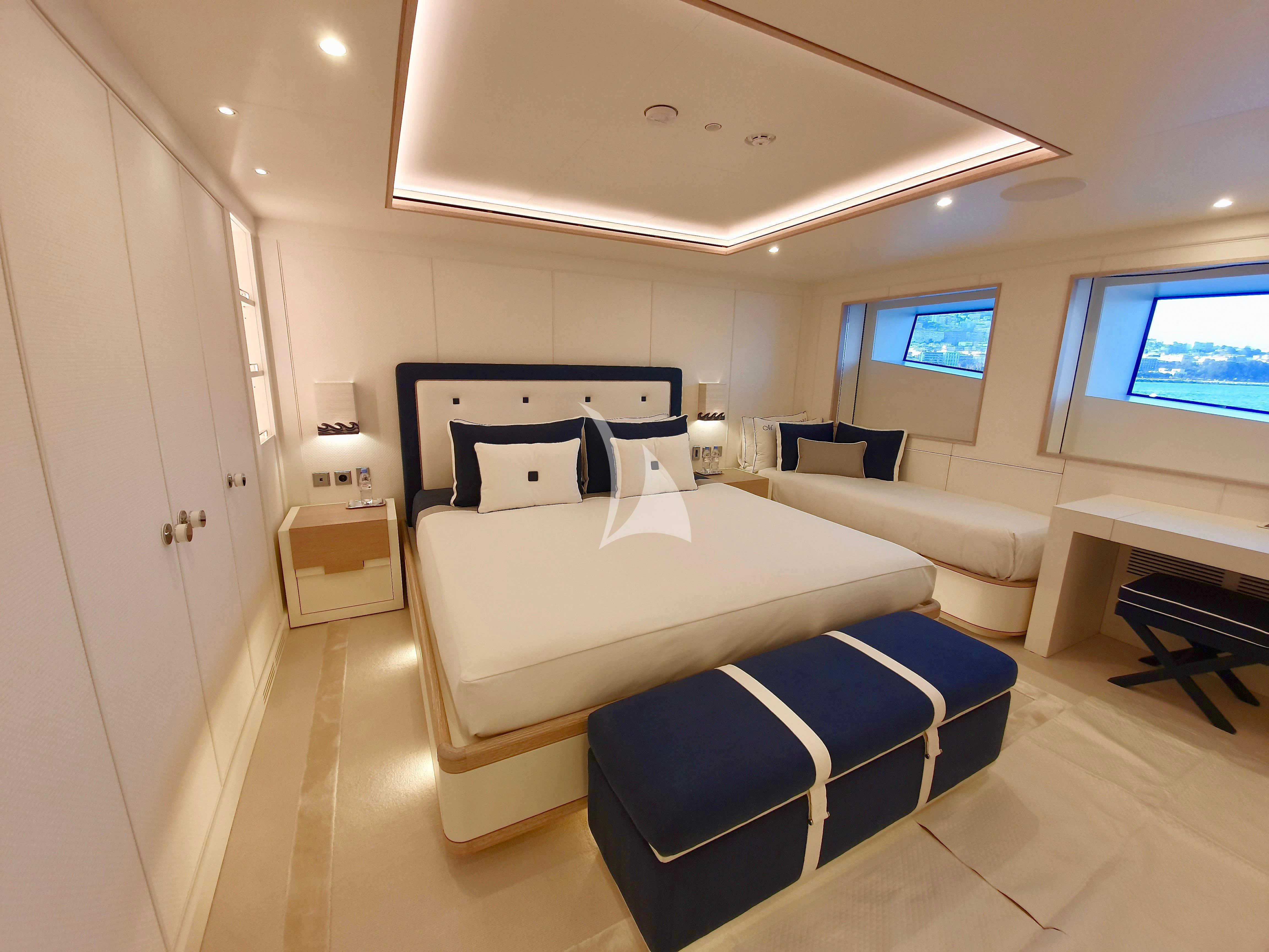 a room with a bed and a desk aboard MIMTEE Yacht for Sale