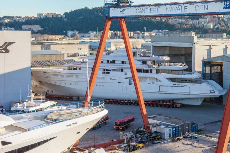 a large orange crane on a ship aboard MIMTEE Yacht for Sale