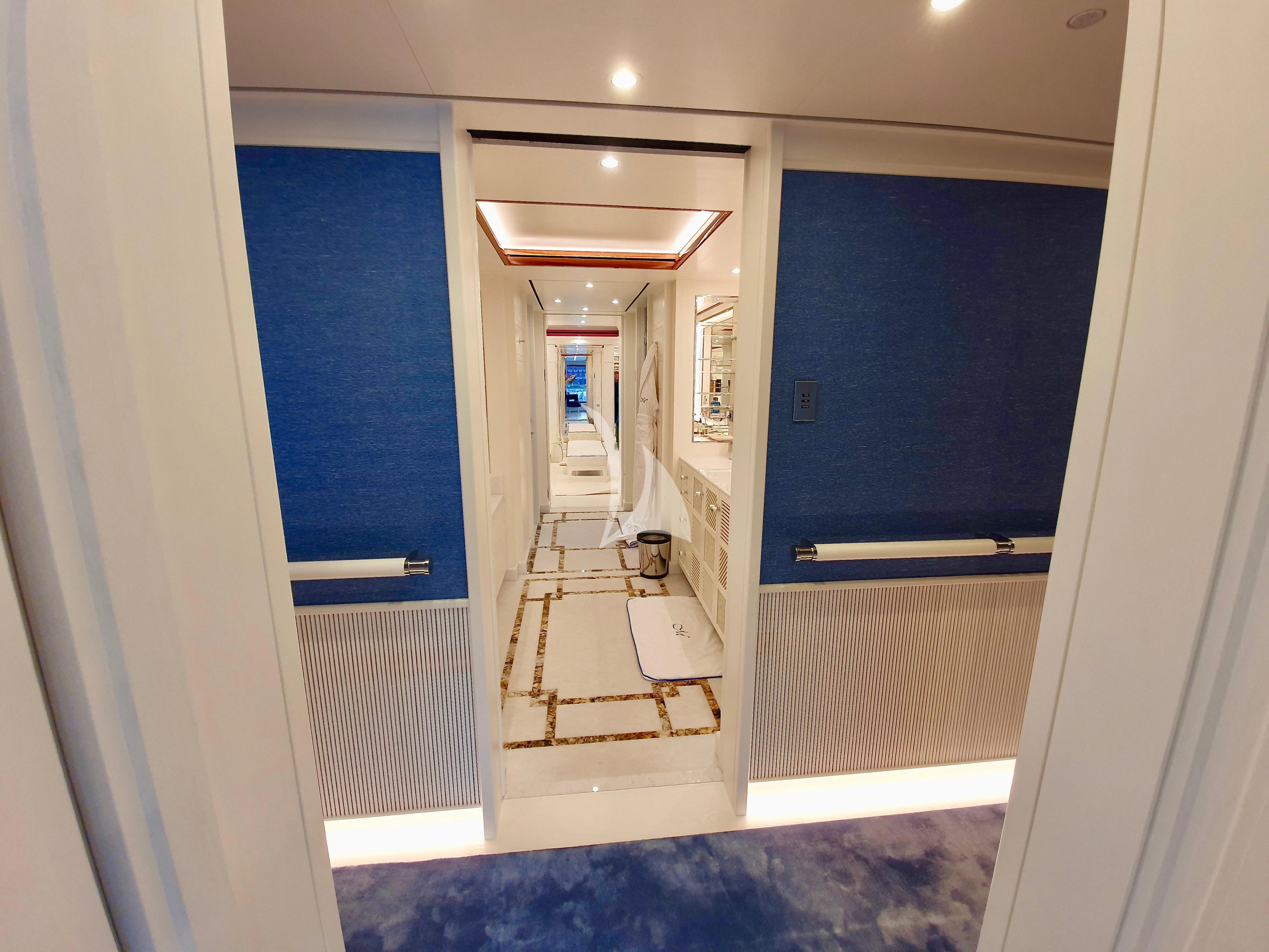 a hallway with a door and a glass door aboard MIMTEE Yacht for Sale