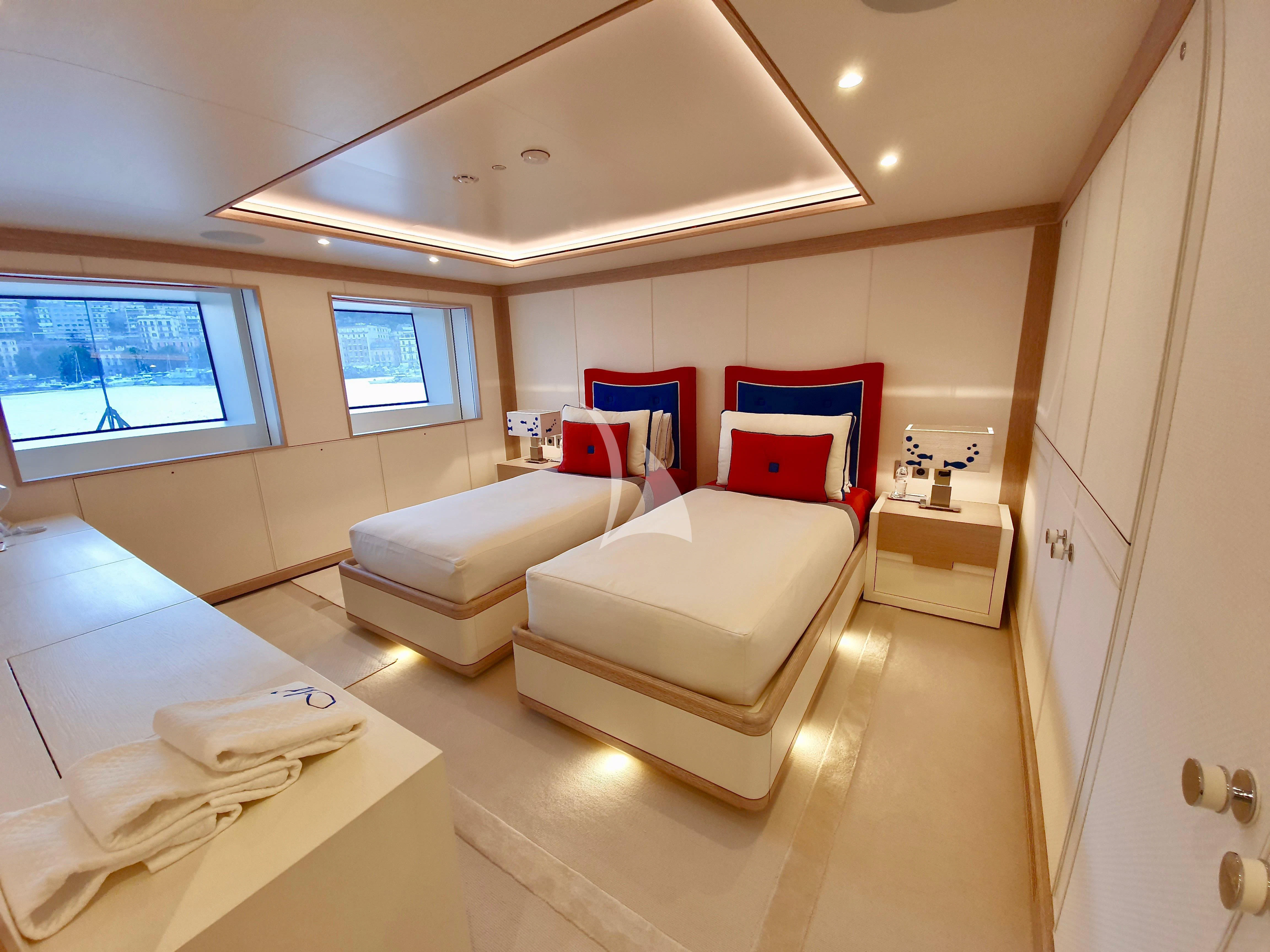 a room with a bed and a red pillow aboard MIMTEE Yacht for Sale