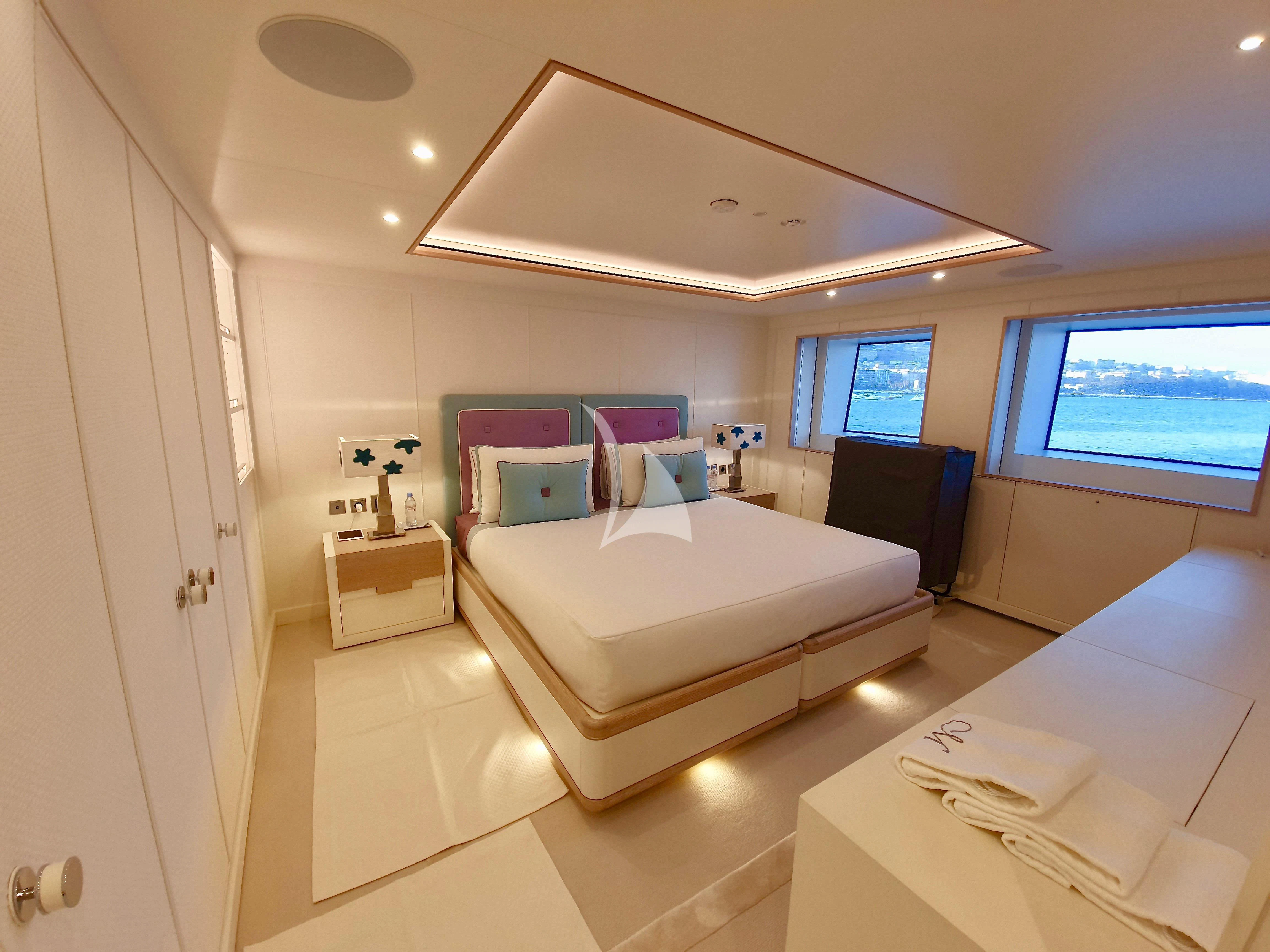 a room with a bed and a window aboard MIMTEE Yacht for Sale