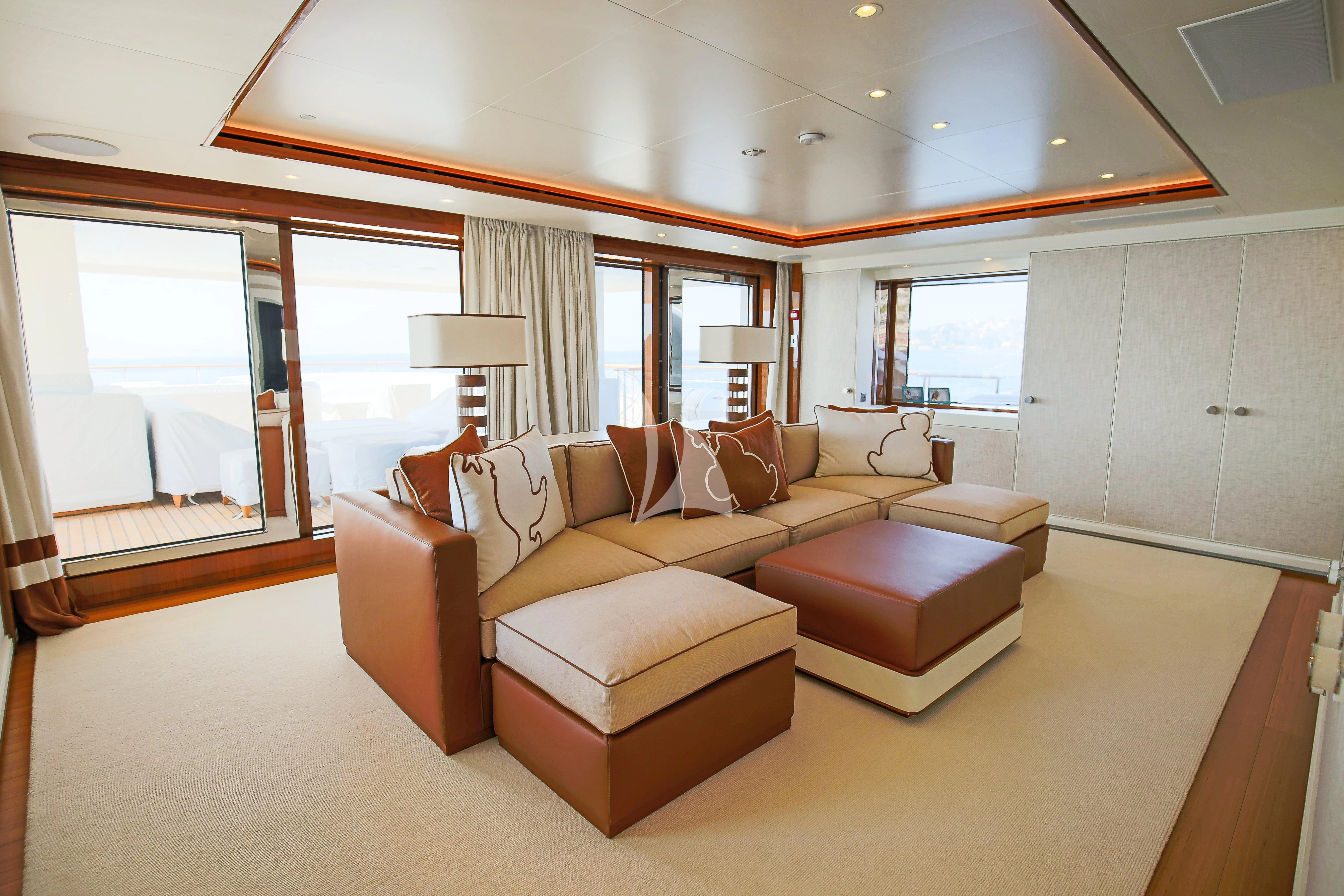 a living room with a couch and a window aboard MIMTEE Yacht for Sale