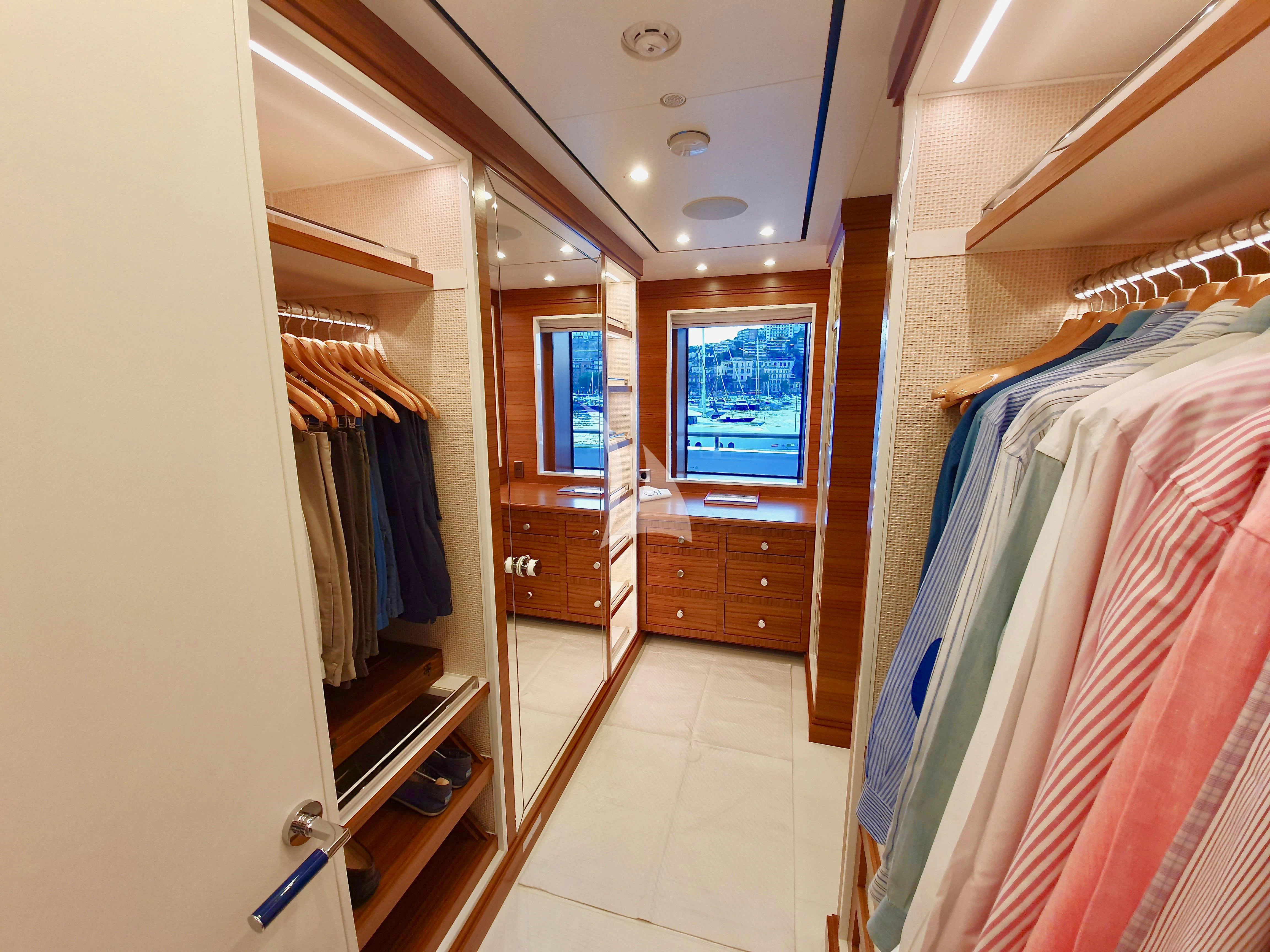 a room with a closet and a bed aboard MIMTEE Yacht for Sale